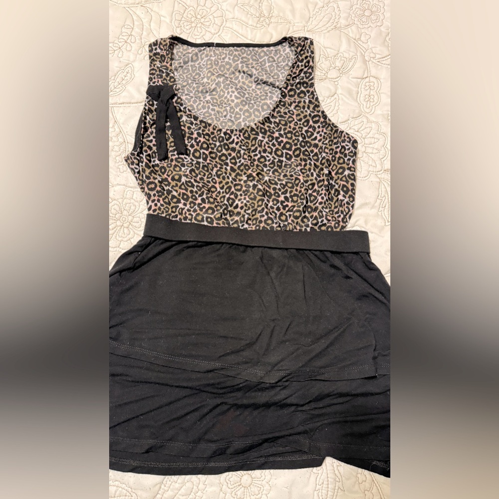 Black skirt, soft fabric, nice texture. With leopard top. Silk